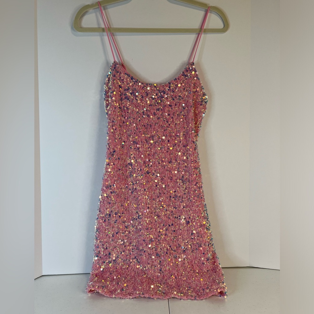 Stretch crinkle velvet covered w/pink iridescent sequins.  Special occasion